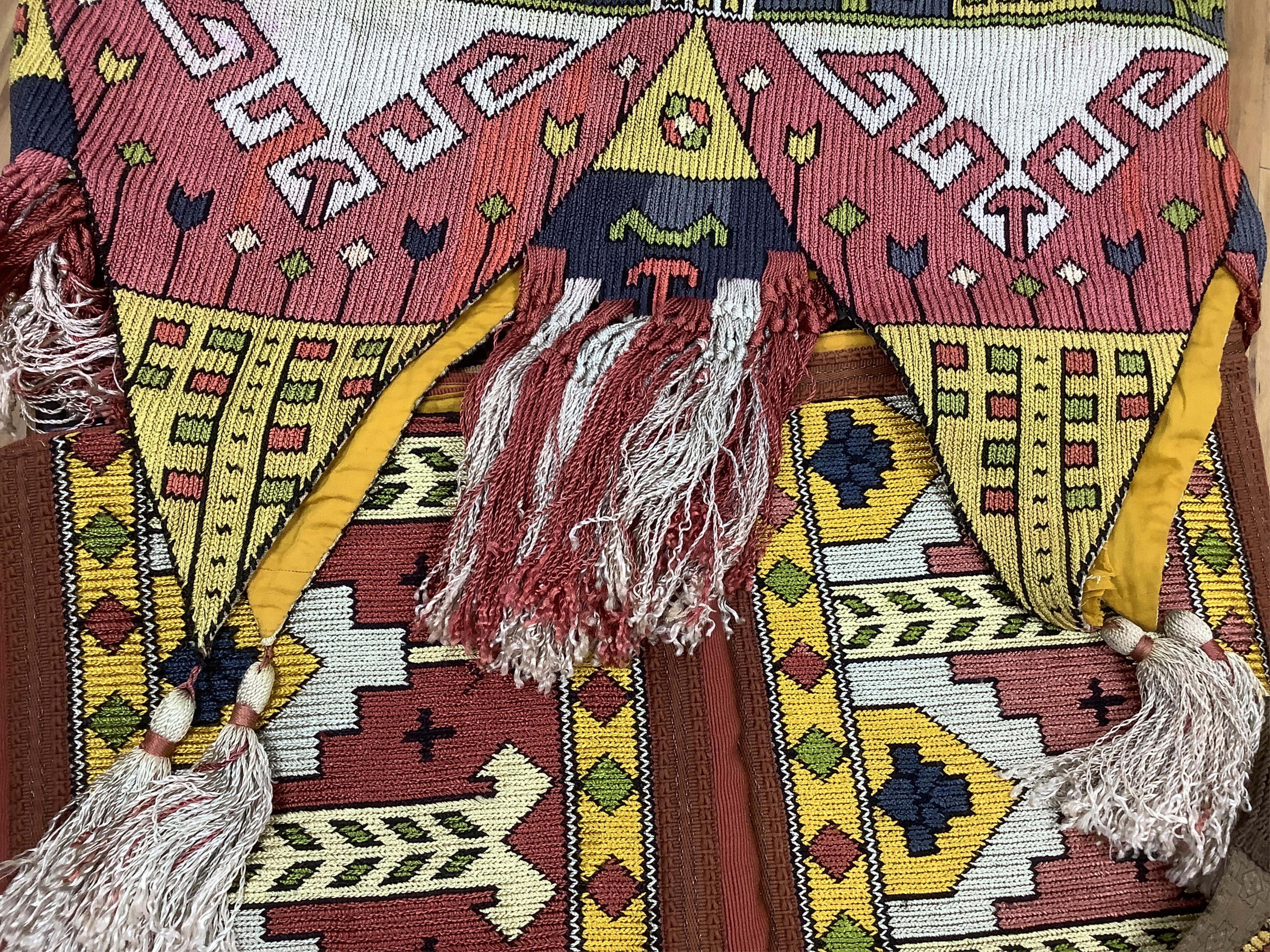 A unusual matching group of 20th century French Ecclesiastical knitted textiles, with Caucasian design elements. Hand embroidered with coloured silks in a bold geometric design, bordered with gold braiding and tasselling